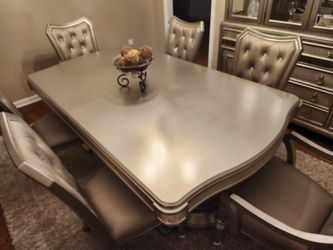 6  chairs, 2 arm chairs , 4 side chairs and dining table