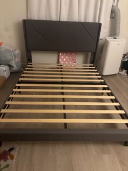 Grey bed frame with headboard