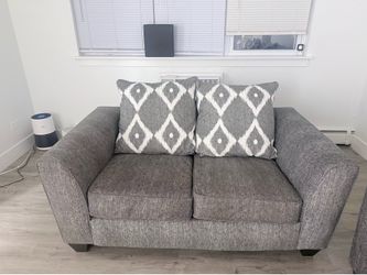 Grey couch with love seat