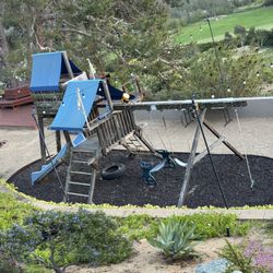 Rainbow Playground  Structure.  Includes Rubber Enclosure And Rubber Mulch
