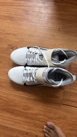 Nike white and black football cleats size 11.5