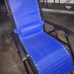 GENTLY USED ROYAL BLUE RECLINING LAWN CHAIR 