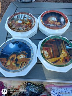 Set of four Garfield collectible plates