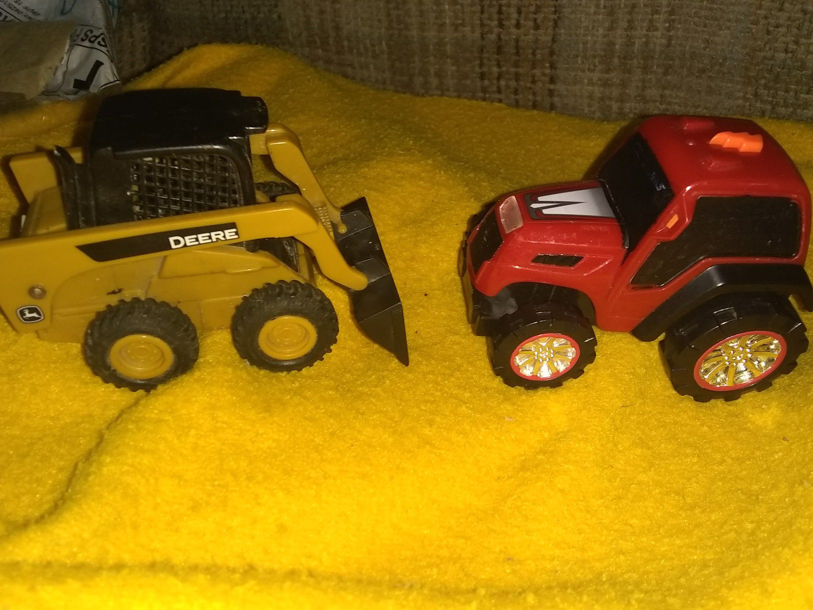 A John Deere mini front in loader & a road rippers tractor!