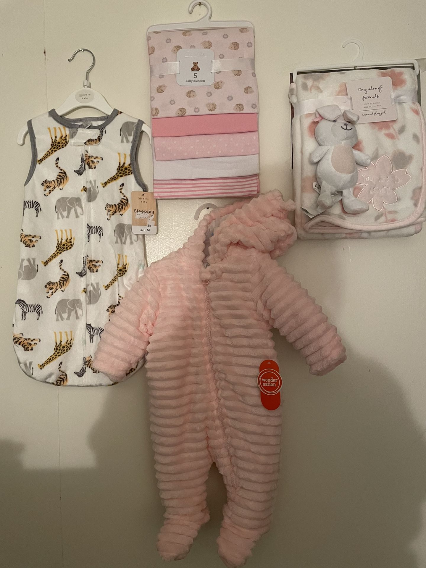 Brand-New Baby Clothes And Blankets