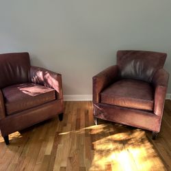Two Leather Crate and Barrel Chairs