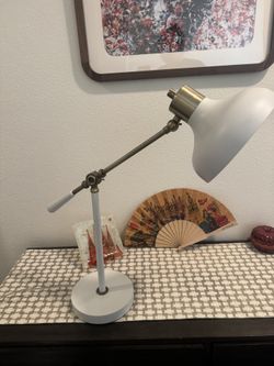 White Lamp With Brass Colored Details. Adjustable Lamp Head