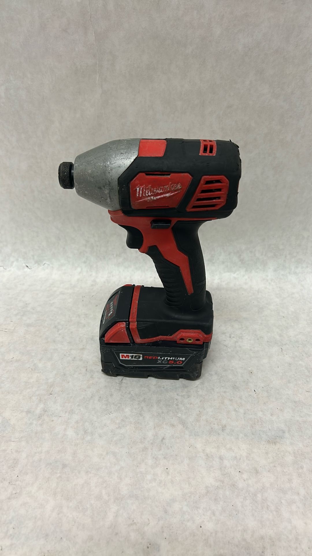 Milwaukee quarter inch hex impact driver with XC 5.0 battery new charger