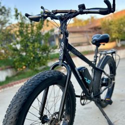 The ebike shown is an EMOJO Wildcat. It's a fat-tire electric mountain bike known for its versatility across various terrains.  