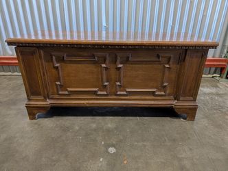 Vintage Dark Wood Storage Chest with Carved Panel Design