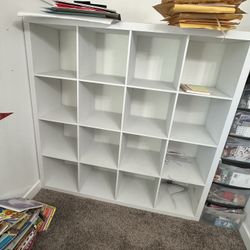 Office full of white furniture plus chair