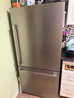 Silver refrigerator and bottom freezer