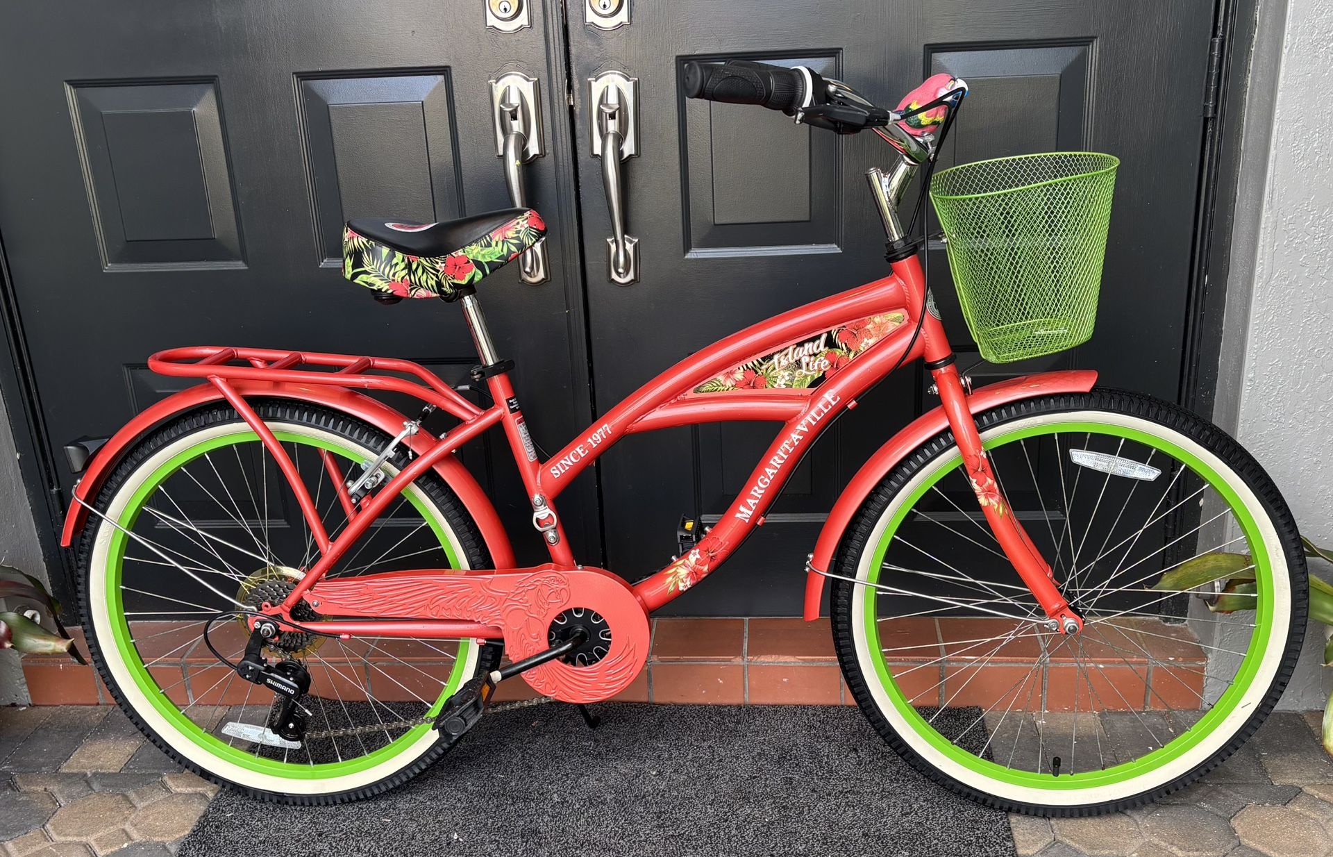 Margaritaville 24 Island Life Multi-Speed Cruiser Girls Bike, Coral/Green for riders 4’6” & up