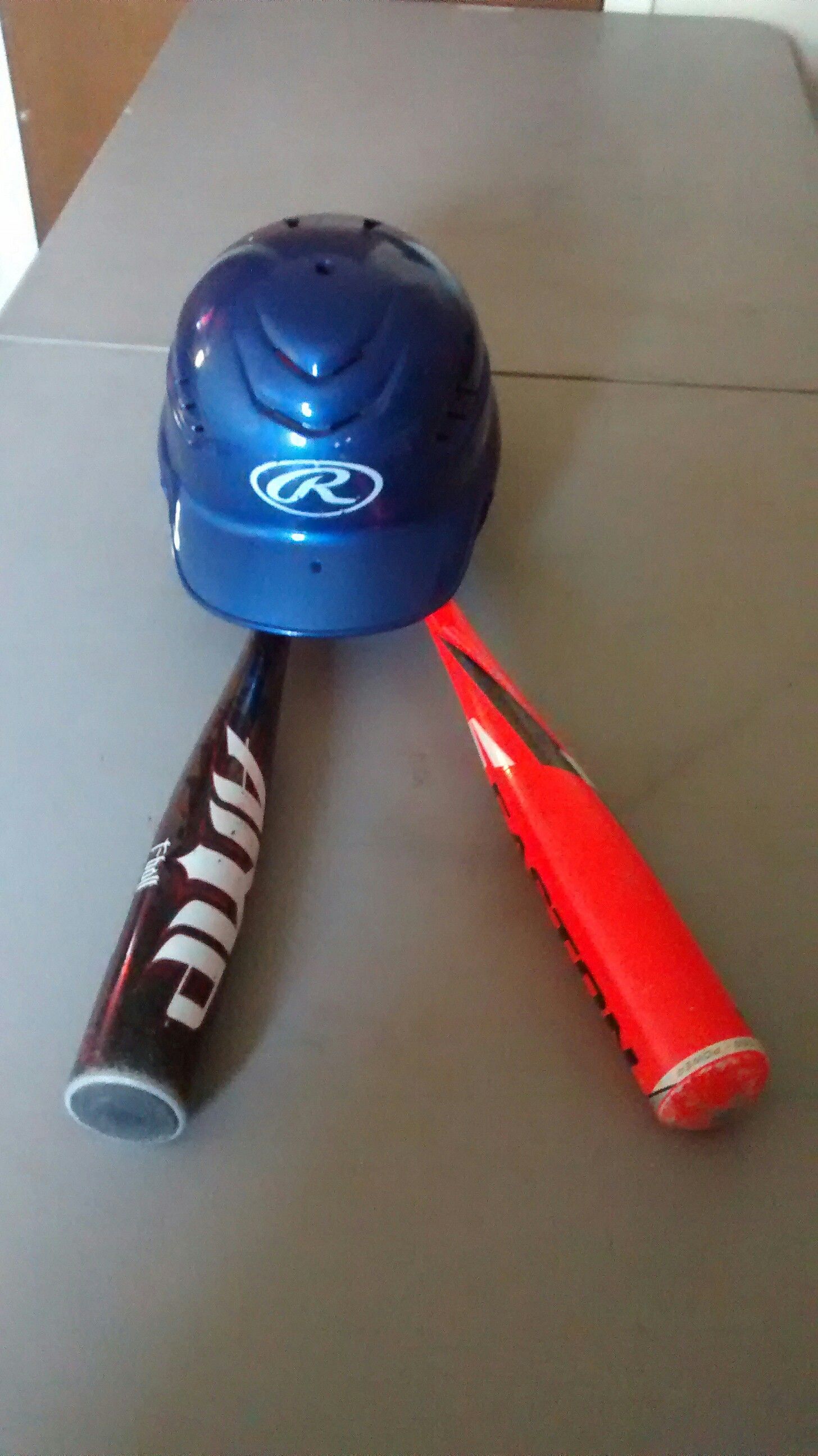 Baseball bats and helmet