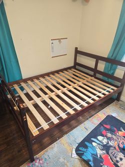 Full bed with rolling twin trundle
