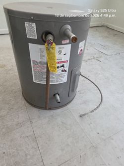 20-gallon, 220V electric Rheem water heater; works perfectly with no issues. It was replaced by a larger one.