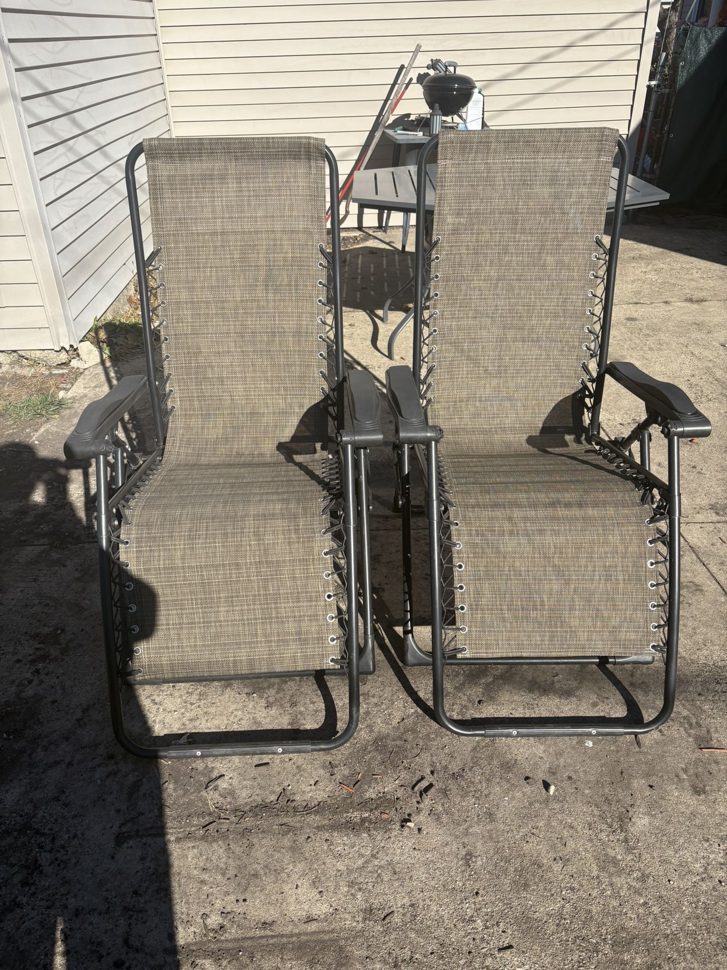 Tan Zero gravity yard chairs (2)