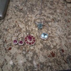 Two Sets One Ruby N White Topaz In Sterling Silver,Necklace And Matching Leverbck Eaarings,And Blue Topaz N White Topaz  Necklace With Matching Size 9