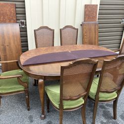 Vintage “Ethan Allen” Wood Dining Table with 6 Cane Back Chairs and 2 Leaves