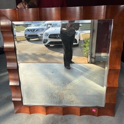 Beautiful Sculpted wooden Mirror 4’ by 4’ , rich Brown.