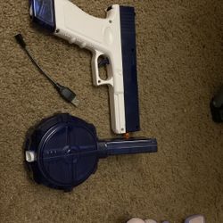 Realistic water gun and charger