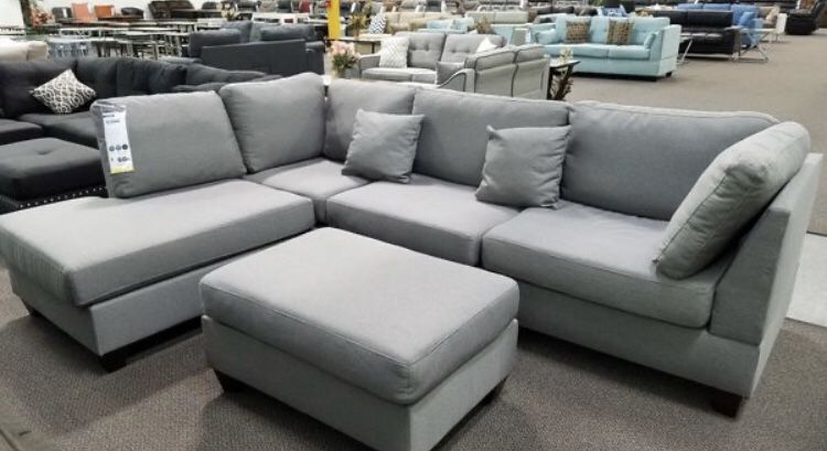 Grey sectional sofa with ottoman new in box