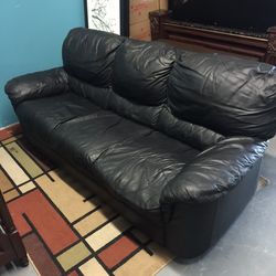 Black leather sofa couch