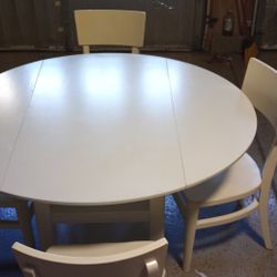 Oval Solid Wood Dining Table And Four Chairs 