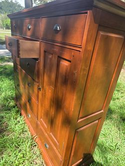 Spacious wooden dresser with multiple drawers. $90 Located Mount Dora Fl 32757
