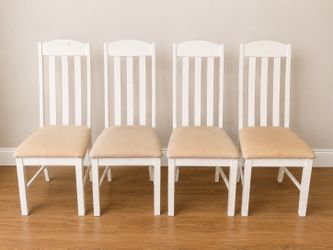 Set a four white wooden dining chairs