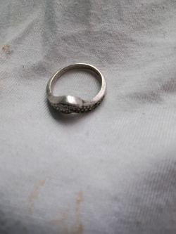 This is a sterling silver marcasite wing ring featuring a split, bypassing design.