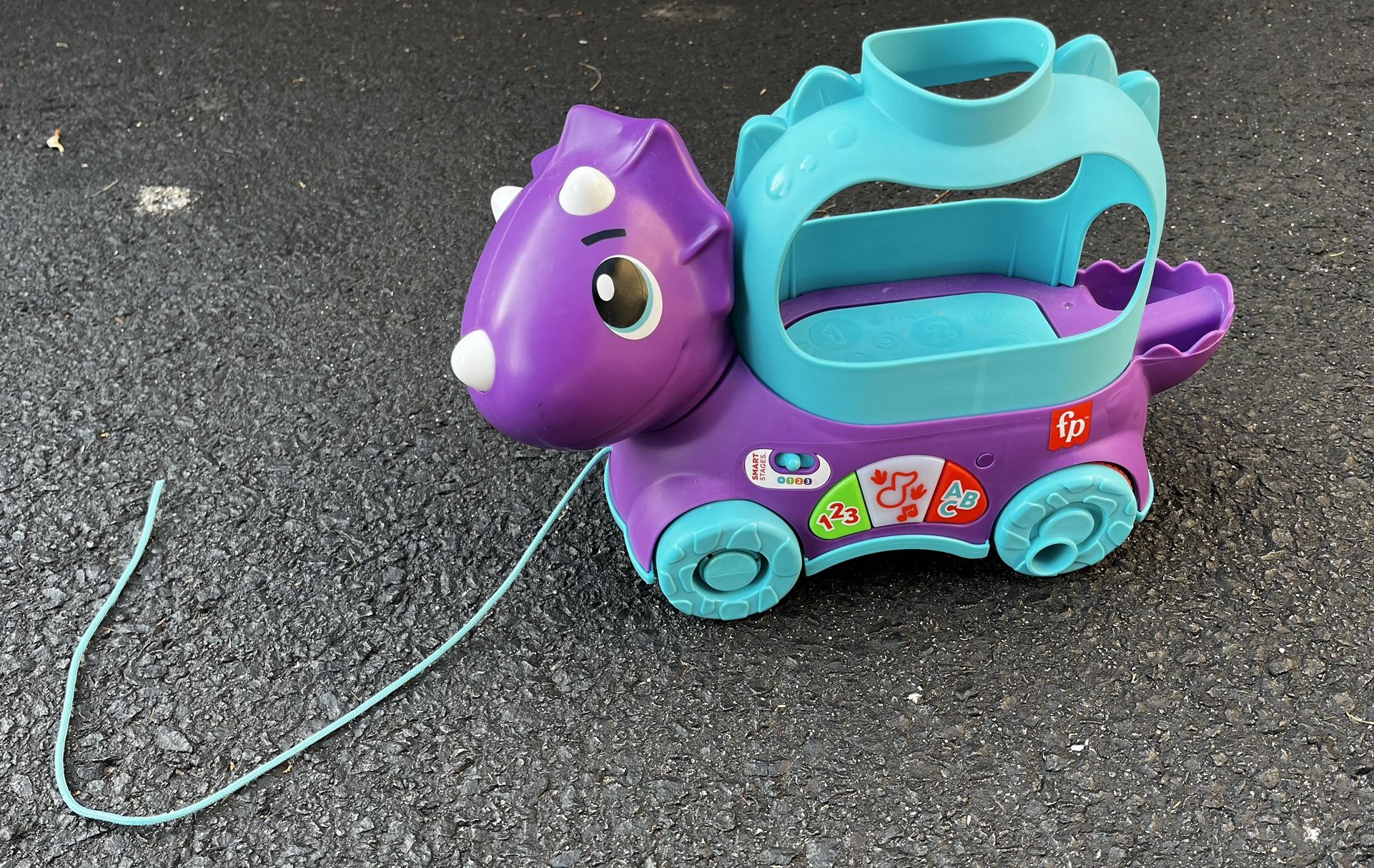 Fisher-Price toddler learning toy poppin’ triceratops dinosaur pull-along toy with music and sounds