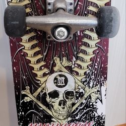 Vintage contoured wooden Mongoose skateboard from the mid-1990s