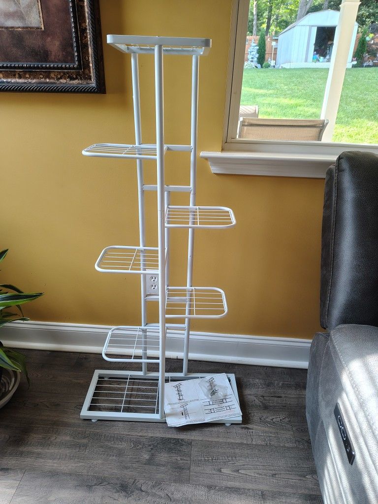 NEW IN BOX. I PUT IT TOGETHER, 7 TIERS, PLANT STAND. VERY NICE. SEE PHOTOS. CASH, PICKUP ONLY.