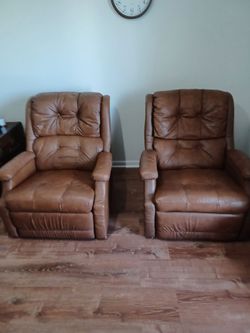 Two brown recliner chairs very