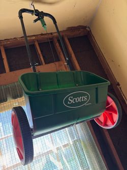 Seed and fertilizer spreader