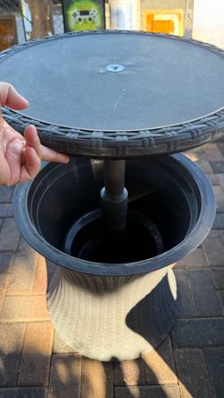 Outdoor Rattan-Style Cool Bar Table. Used in good condition $25 pick up only