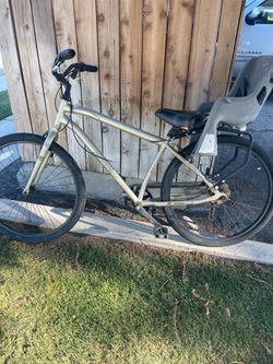 Huffy bike with kids seat on it