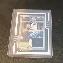 Dak Prescott card with a piece of his jersey in it in a hard protective case.  $10