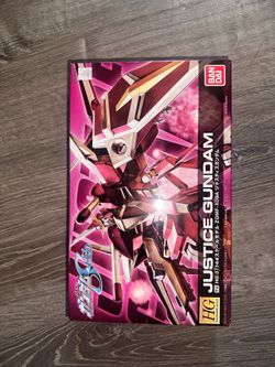 This is a Bandai HG 1/144 scale model kit box of the ZGMF-X09A Justice Gundam from Mobile Suit Gundam SEED