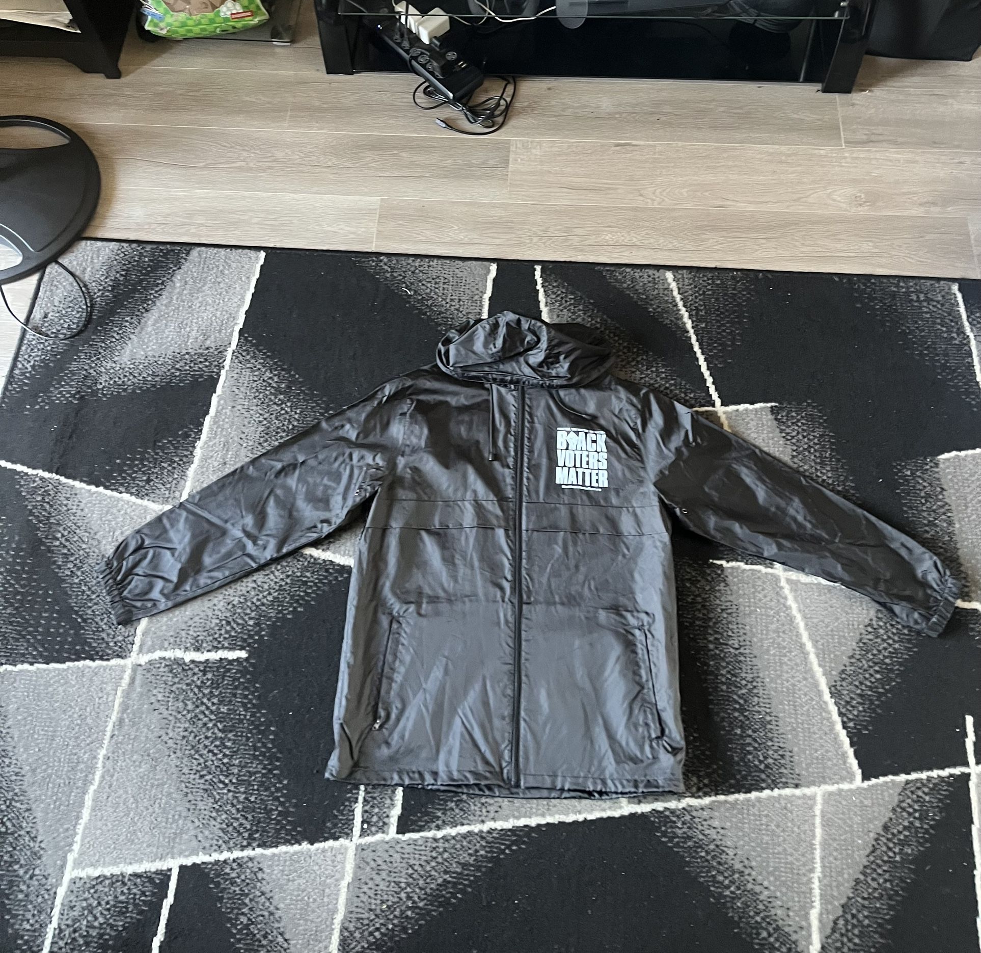 Black "IT'S ABOUT US" Graphic Raincoat Windbreaker Hooded Jacket Men's Large L Lightweight Outerwear