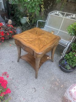 Vintage night stand made w exotic wood and is very sturdy