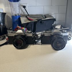 2 Minolta XG-1 Cameras+lens+flash+filters+bag