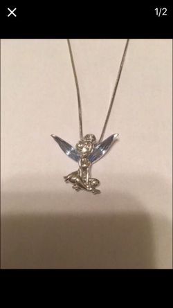 Silver Tinkerbell with blue crystal wings. Never worn