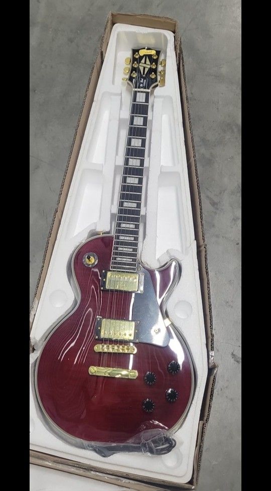 Les Paul Custom electric guitar in a wine red finish with gold hardware,