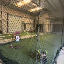 Batting Cage 65ft long comes with turf, backstop, pitching mat, and batting mat.
