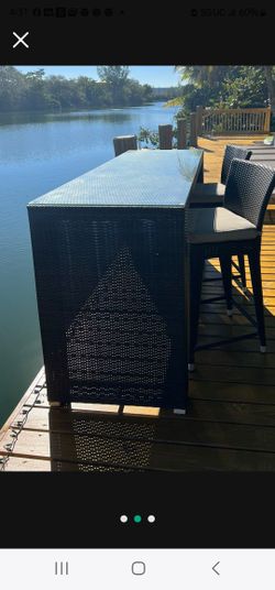 Wicker table and Two bar Stools