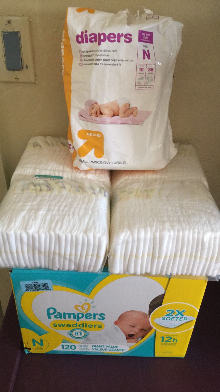 Newborn diapers/ newborn clothes
