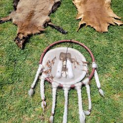 dream catcher and two goat skins