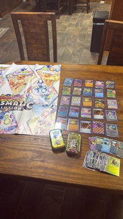 Pokemon 85 foils 2 empty tins and a poster